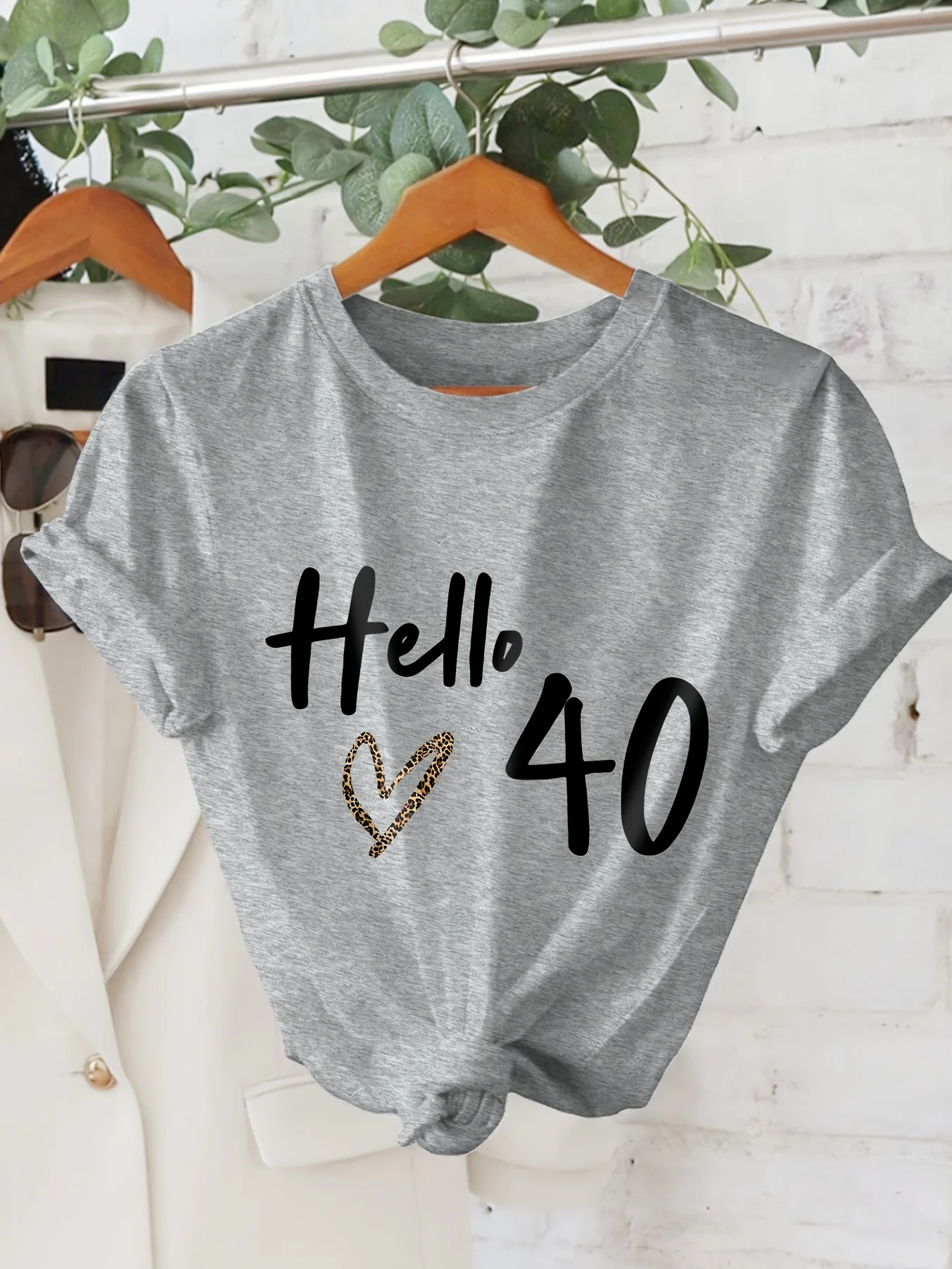 

Hello 40" Graphic Print T-Shirt Short Sleeve Crew Neck Casual Women Black with White Lettering Heart Design Aesthetic Clothes