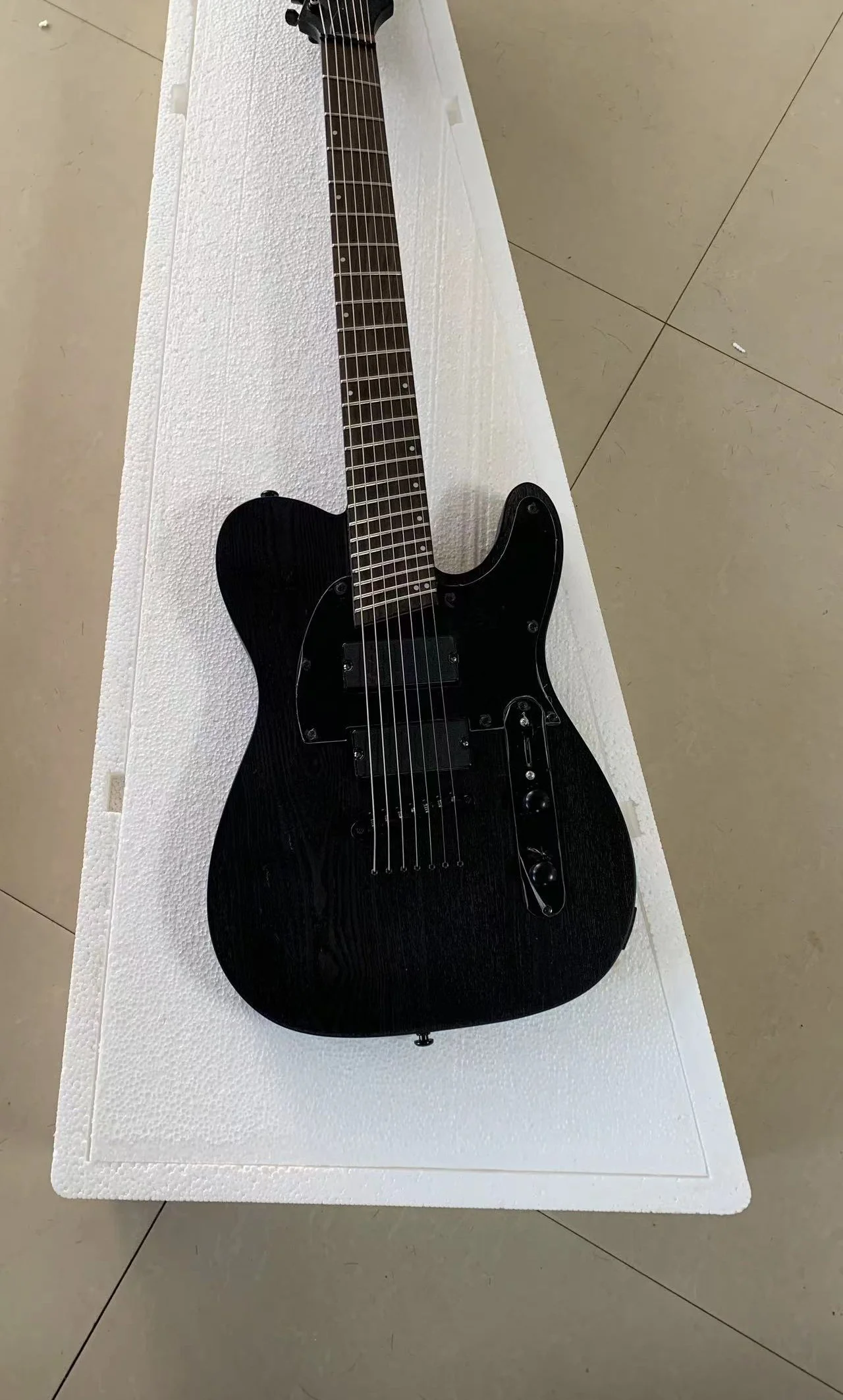 High-end custom 7-string oblique electric guitar, classic shape, transparent black ash body, active pickup, free delivery