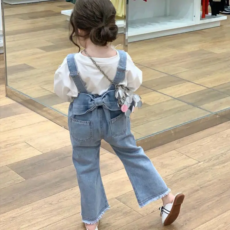 2023 Herbst neue Mädchen Overalls Kinder Riemen Hose Baby Mädchen zurück Bogen Denim Overalls Kinder Stretch Jeans Baby kleidung