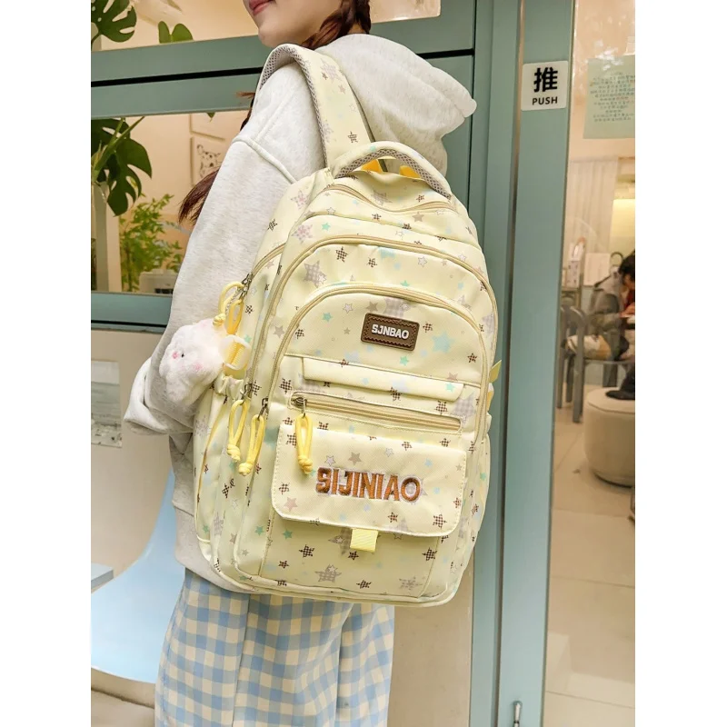 

Star-printed backpack for female junior high and high school students, multi-pocket, high aesthetic valueinsLarge-capacity campu