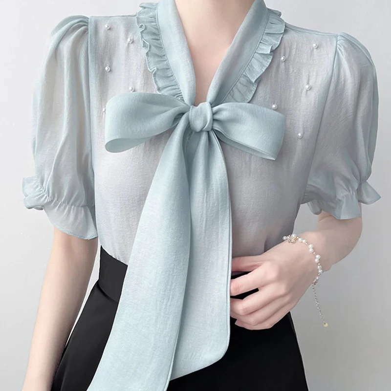 Verano moda coreana arco cordones bordado bengalas camisas 2025 nueva manga corta con cuello en V todo-fósforo volantes blusa mujeres Tops