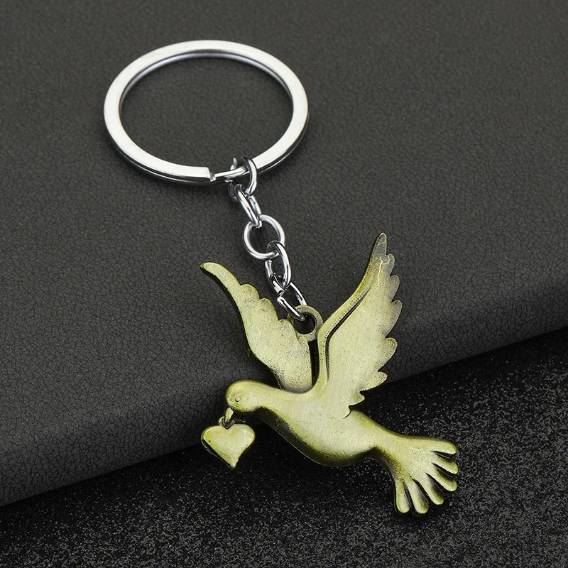 keychain dove Christianity Jesus Holy Spirit Peace Dove Retro Jewelry Necklace Exquisite Car Keychain Pendant Keychain Wholesale