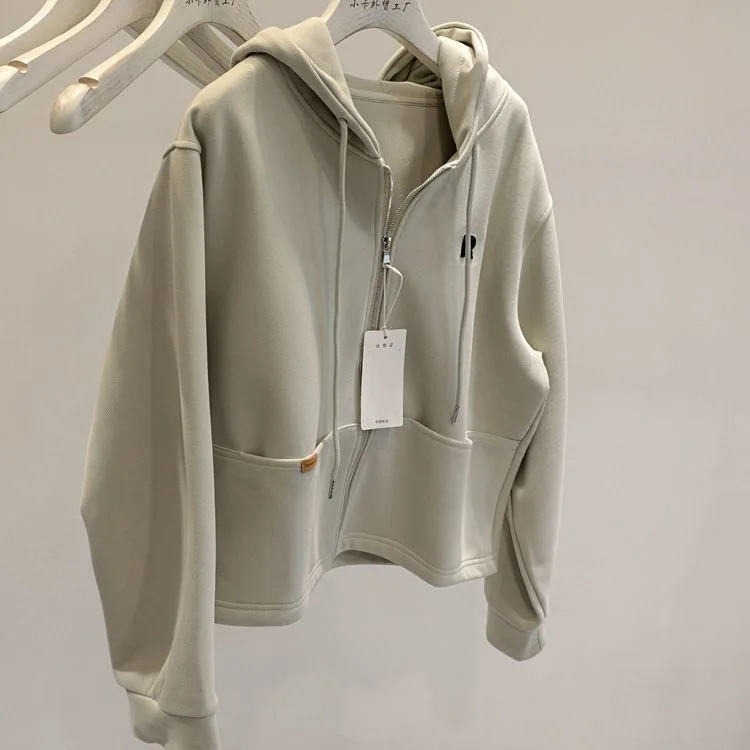 秋の新シンプルな無地カジュアルスポーツスタイルショートパーカーオープンカーディガン女性のファッションルーズ長袖ジッパーコート