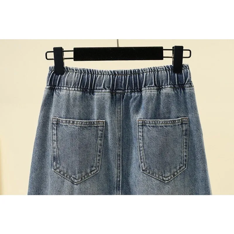 Saia jeans linha A metade do corpo onda coreana feminina, cintura alta, versátil e elegante, comprimento do joelho, monocromática, 2024