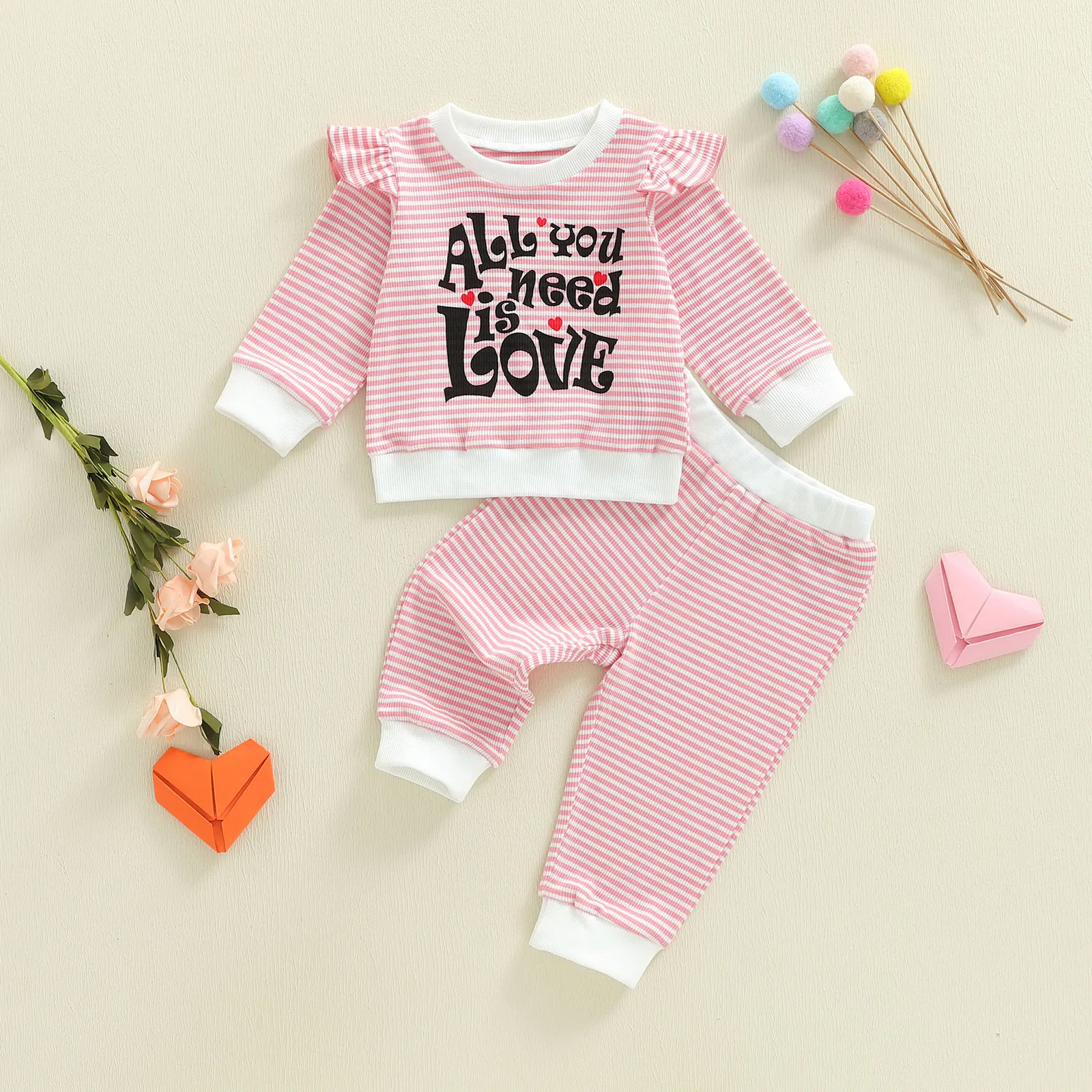 

Tregren Toddler Baby Girl Valentines Day Outfit Striped Letter Heart Print Ruffle Long Sleeve Sweatshirt and Joggers 2 Piece Set
