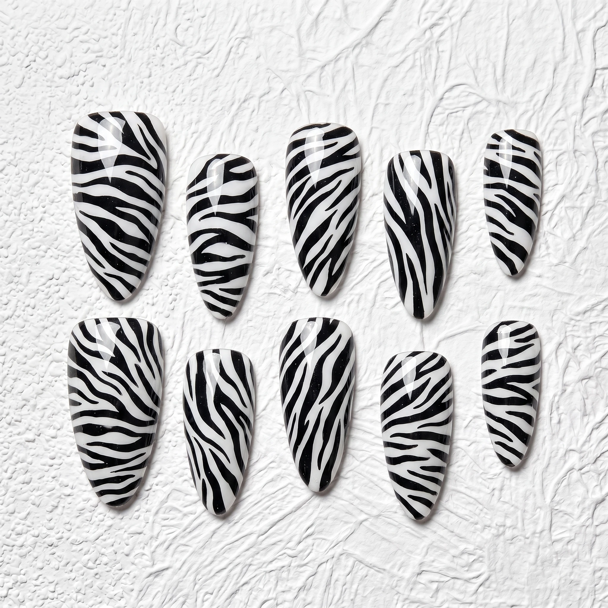 Artisan Handcrafted 10PCS Almond Zebra Print Press-On Nails | Bold Black & White Stripes, Glazed Finish, Subtle Sparkle, Party D