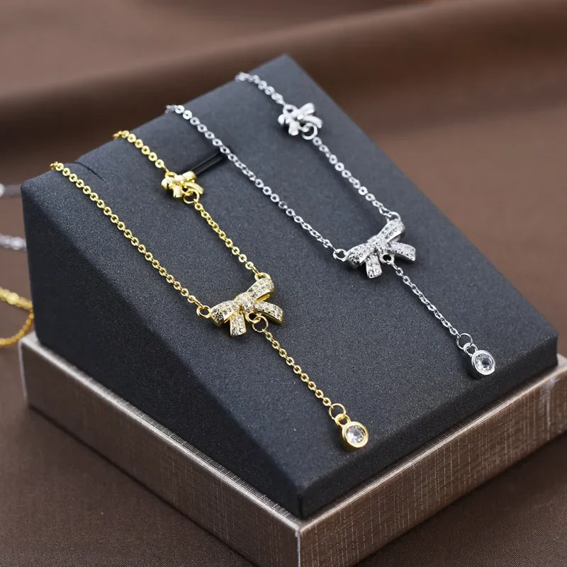 

New titanium steel butterfly necklace, women's bow tassel pendant, collarbone chain, niche design