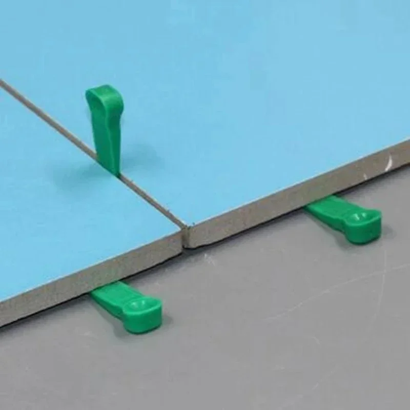 Tile laying floor tiles wall tiles  adjusting joints wedges leveling devices  plastic spacers small washers small inserts gaps
