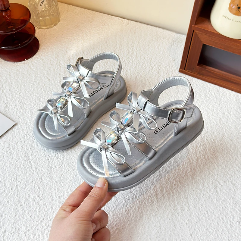 Sandali da ragazza Estate Nuovi bambini Moda Scarpe causali scavate Principessa Versatile Dolce Bowknot Sandali da spiaggia open-toe per bambini