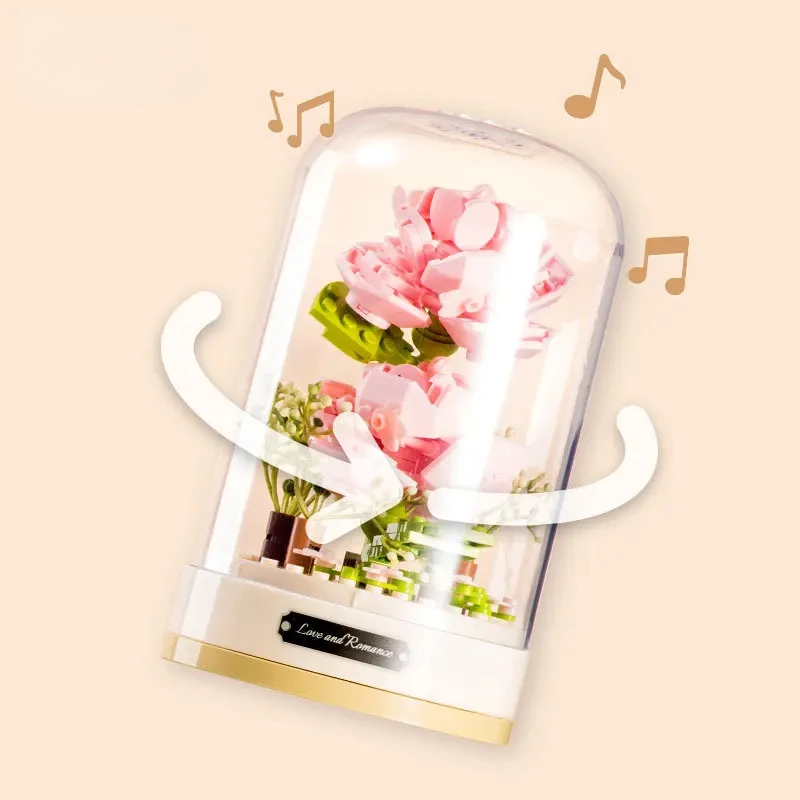 Building blocks music box Clockwork rotating music box Building blocks Rose Lily of the valley puzzle set Valentine\'s Day gift