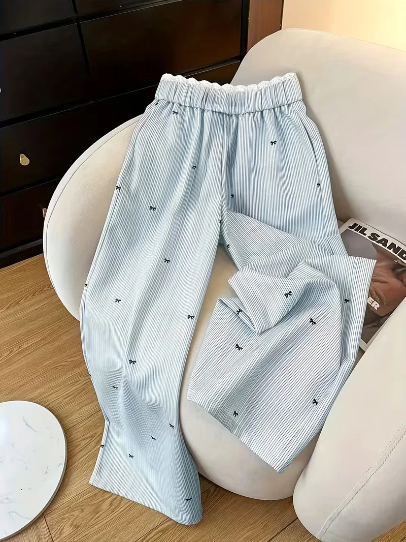 Damesbroek met wijde pijpen, strikaccent en gestreept - Kanten lambrisering, loszittende lange broek,