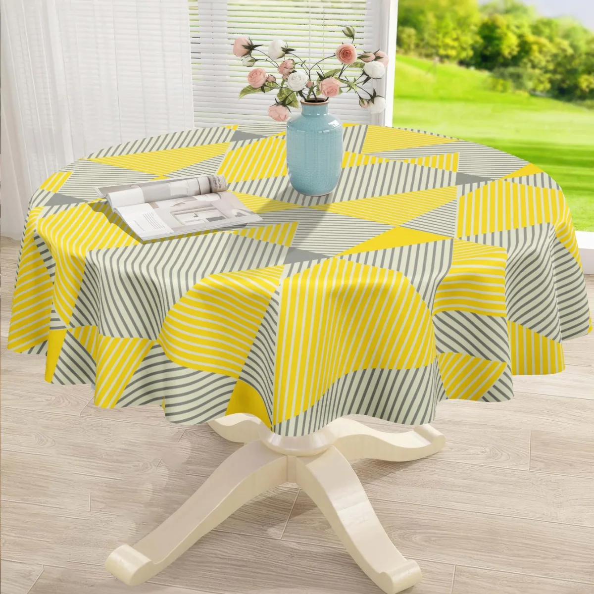 A polyester tablecloth with yellow and gray geometric patterns, available in party tablecloth option