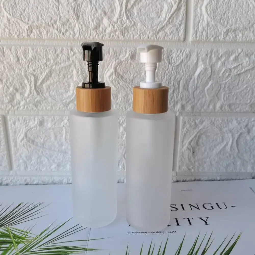 

popular Frosted Clear Glass Lotion Cleanser Bottles ,Cosmetic Packaging Container With Bamboo Pump Sprayer,body wash bottle