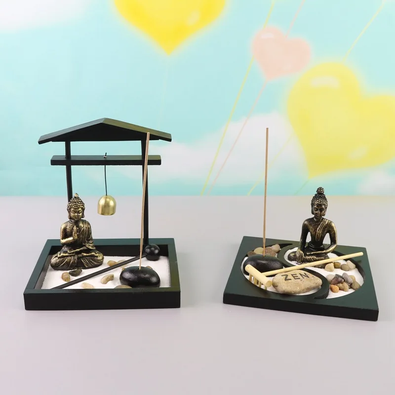 Zen tori garden atmosphera with stones, candle holder, gong and sand for meditation and decoration
