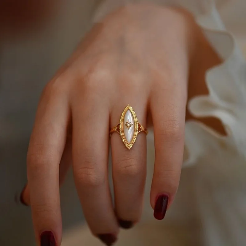 

Light Luxury Design Sense Ancient Gold Craft Court style horse-eye pointed White Fritillaria rings for women Vintage Jewelry