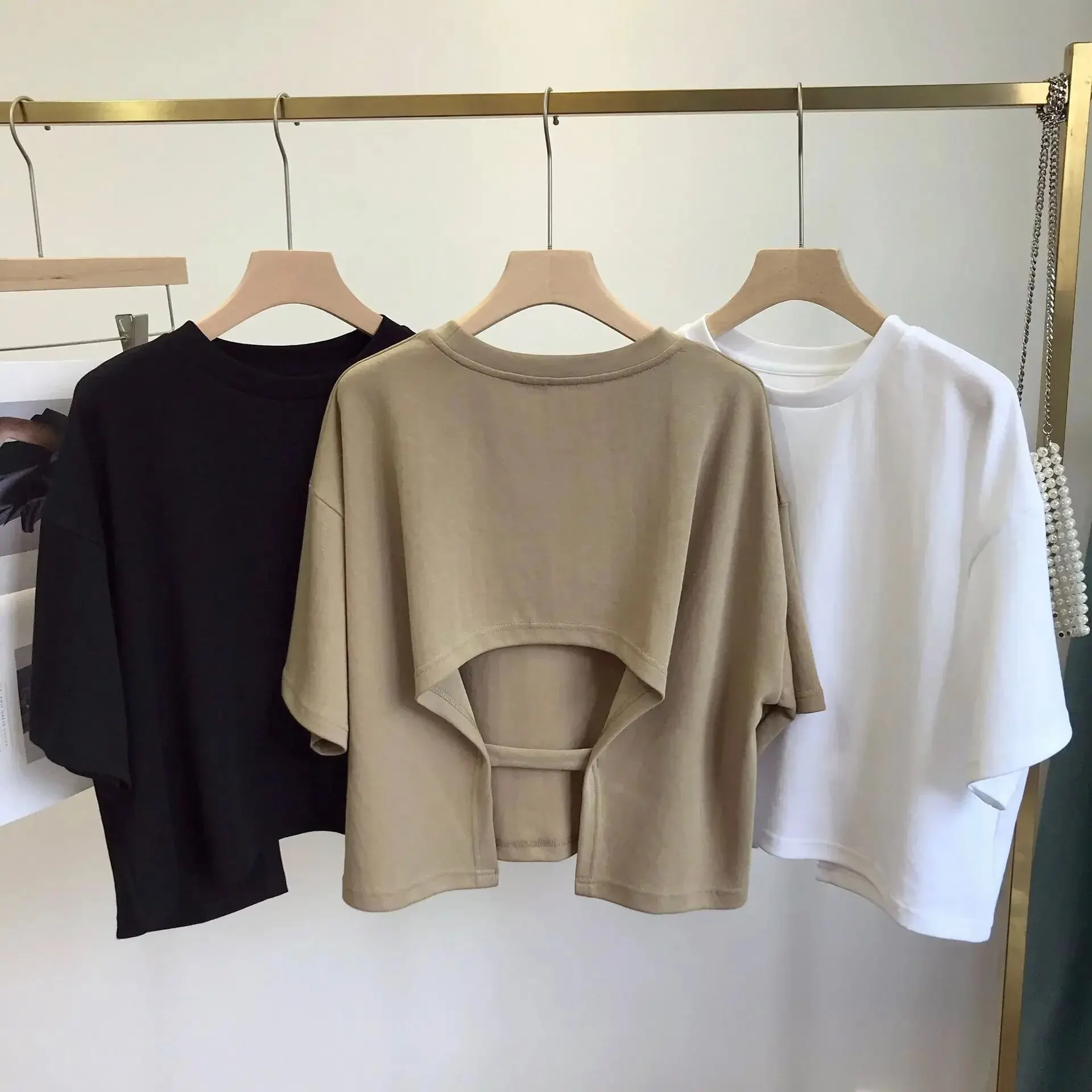 Camiseta corta con espalda descubierta para mujer, Top de manga holgada con cuello redondo, camisa Base calada, tela de poliéster de estilo informal