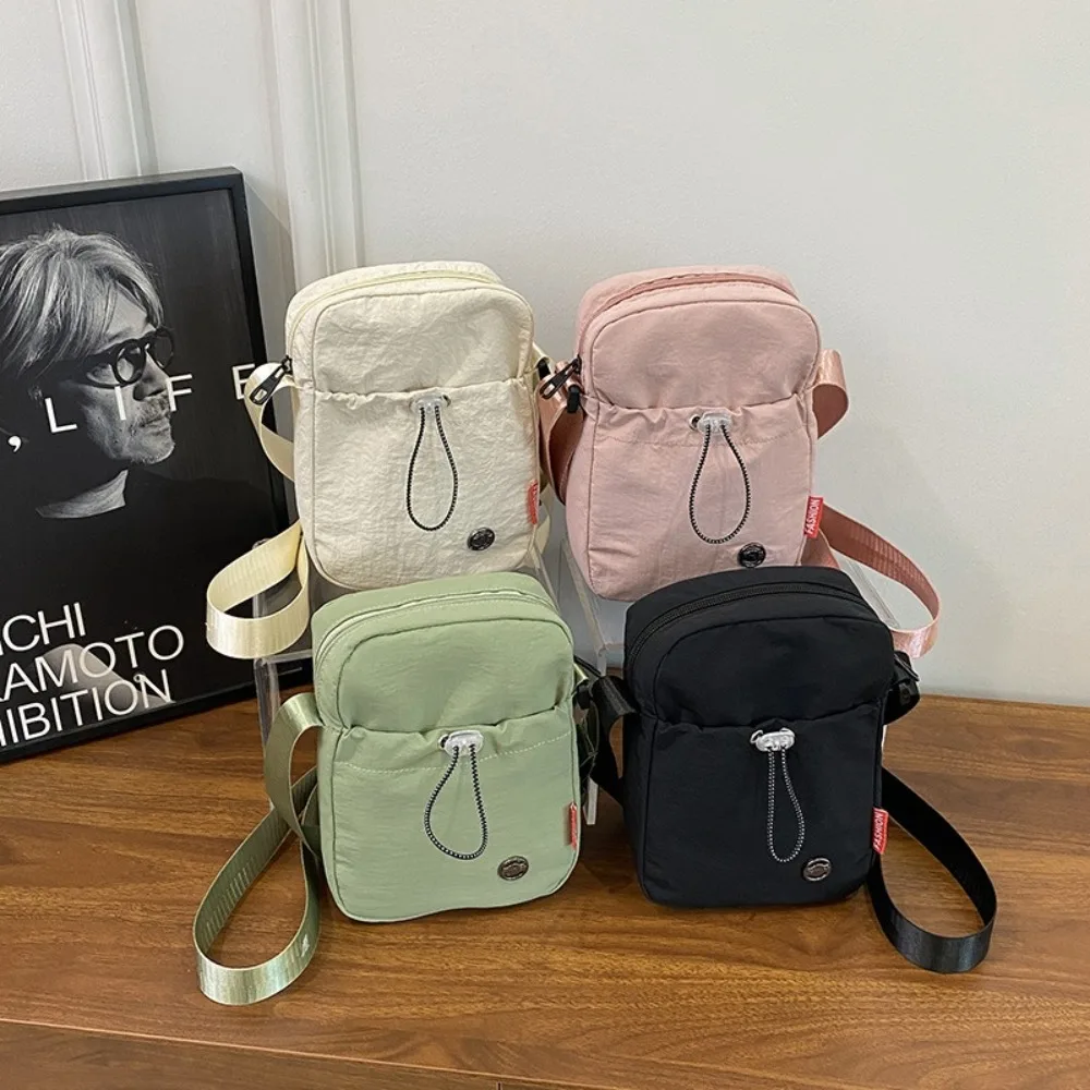 

Solid Color Drawstring Crossbody Bag Korean style Waterproof Water Bottle Carrier Bag Nylon Lightweight Water Cup Bag Women