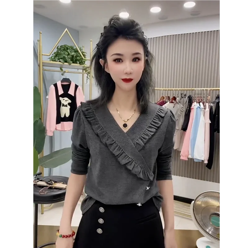 Nuovo stile primaverile e autunnale T-shirt da donna a maniche lunghe con scollo a V irregolare alla moda e versatile