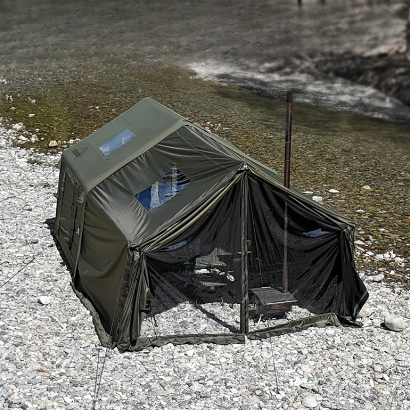 Military green camping canopy inflatable tent stays overnight in the black rubber wilderness