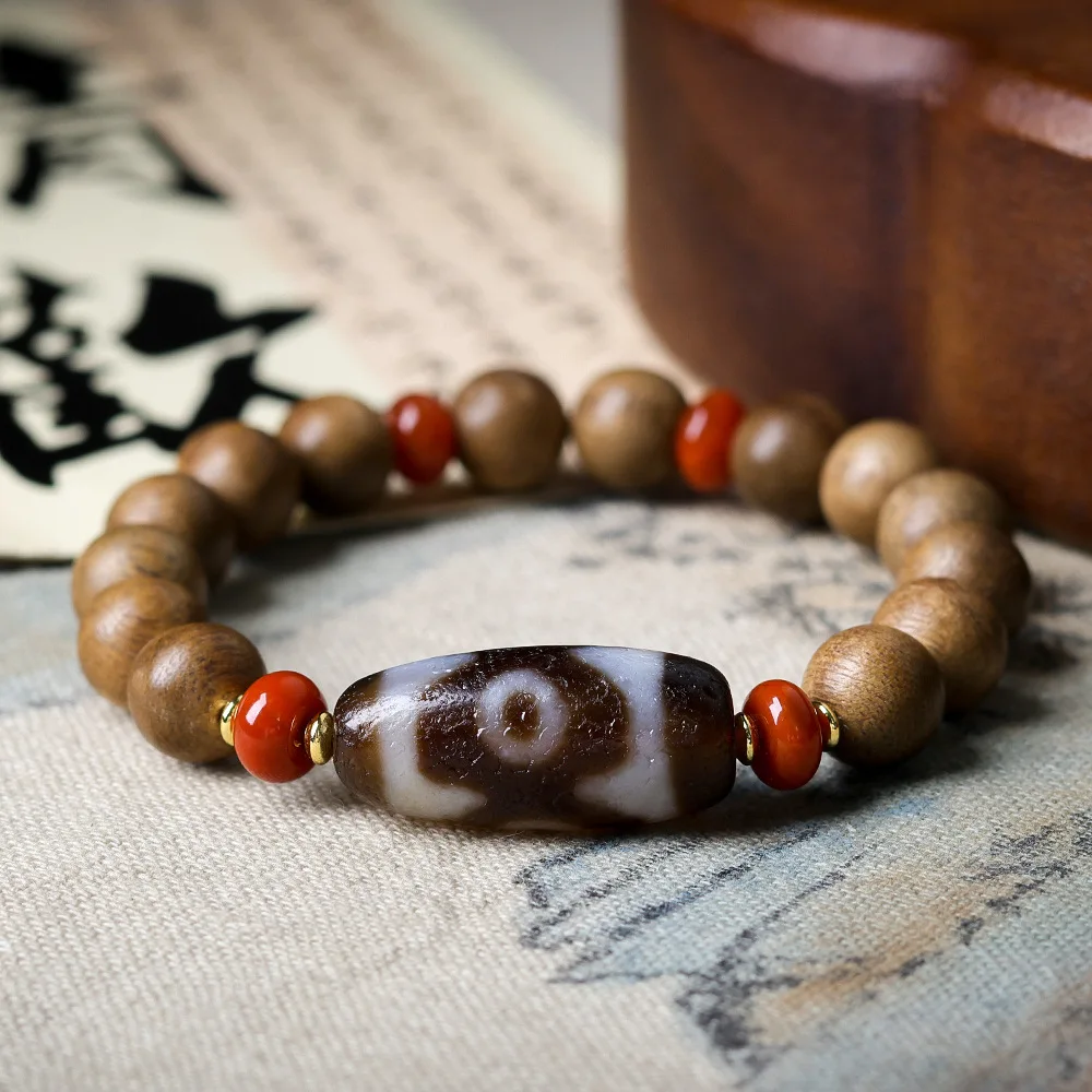 

Yellow Chinaberry Incense Wood BraceletOriginal ManipulationThree-eyed Dzi BeadChinese Style StringsBuddha BeadRead more