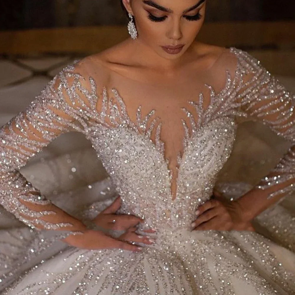 Shiny Arabic Dubai Wedding Dress 2026 Sheer O-neck Long Illusion Sleeves Sequins Tulle Birde Bridal Gowns Vestido De Novia