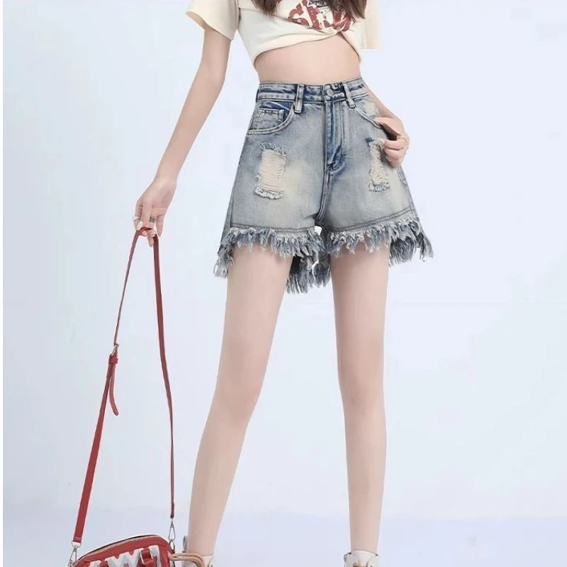 

Женские летние тонкие джинсовые шорты трапециевидной формы с высокой талией, свободные рваные широкие джинсовые шорты с кисточками