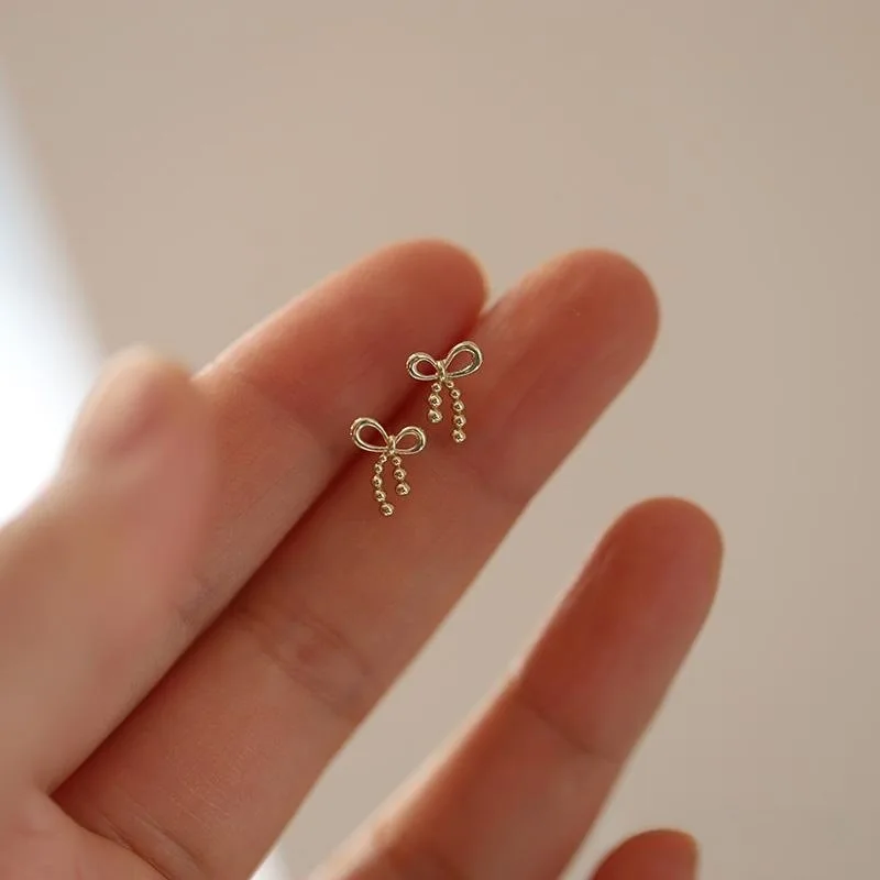 

CCFJOYAS 925 Sterling Silver dotted bow Stud Earrings for Women Korean Style Mini Cute Hollow Bowknot Studs Piercing Jewelry