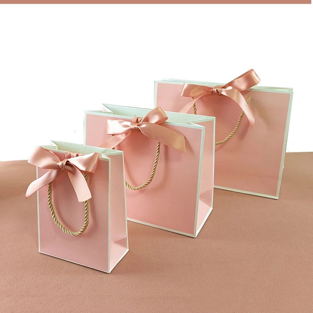 New High Quality Pretty Pink Gift Bag Gift Box Ornament Pajama Book Black Handle With Ribbon Paper Box Bag Kraft Packaging