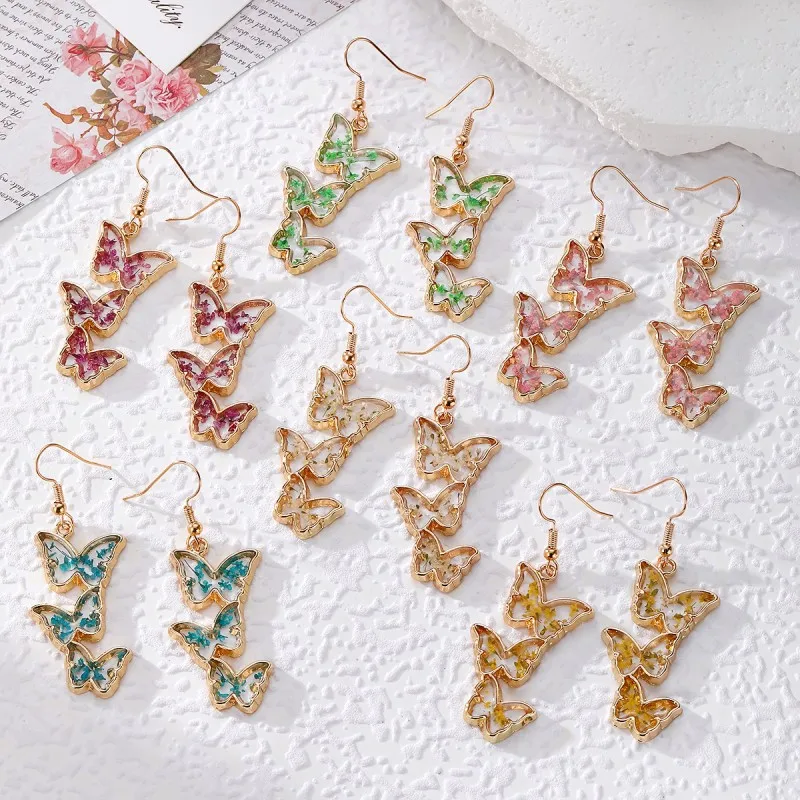 

Unique Butterflies Design Dried Flower Earrings Creative Epoxy Resin Pressed Flower Butterflies Earring Jewelry Custom Packaging