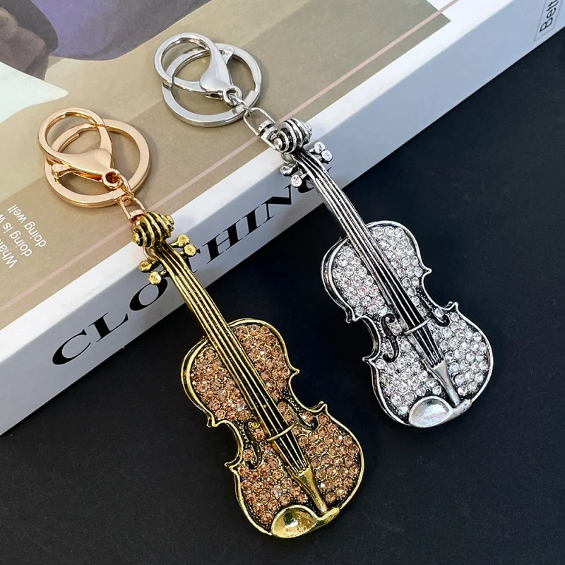 European and American fashionable and unique violin-shaped keychain, suitable for women's bags as accessories or gifts.