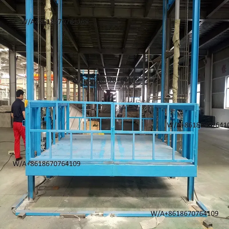 Installation of hydraulic lift fixed rail freight elevator outside the workshop, small simple fixed lifting platform in the