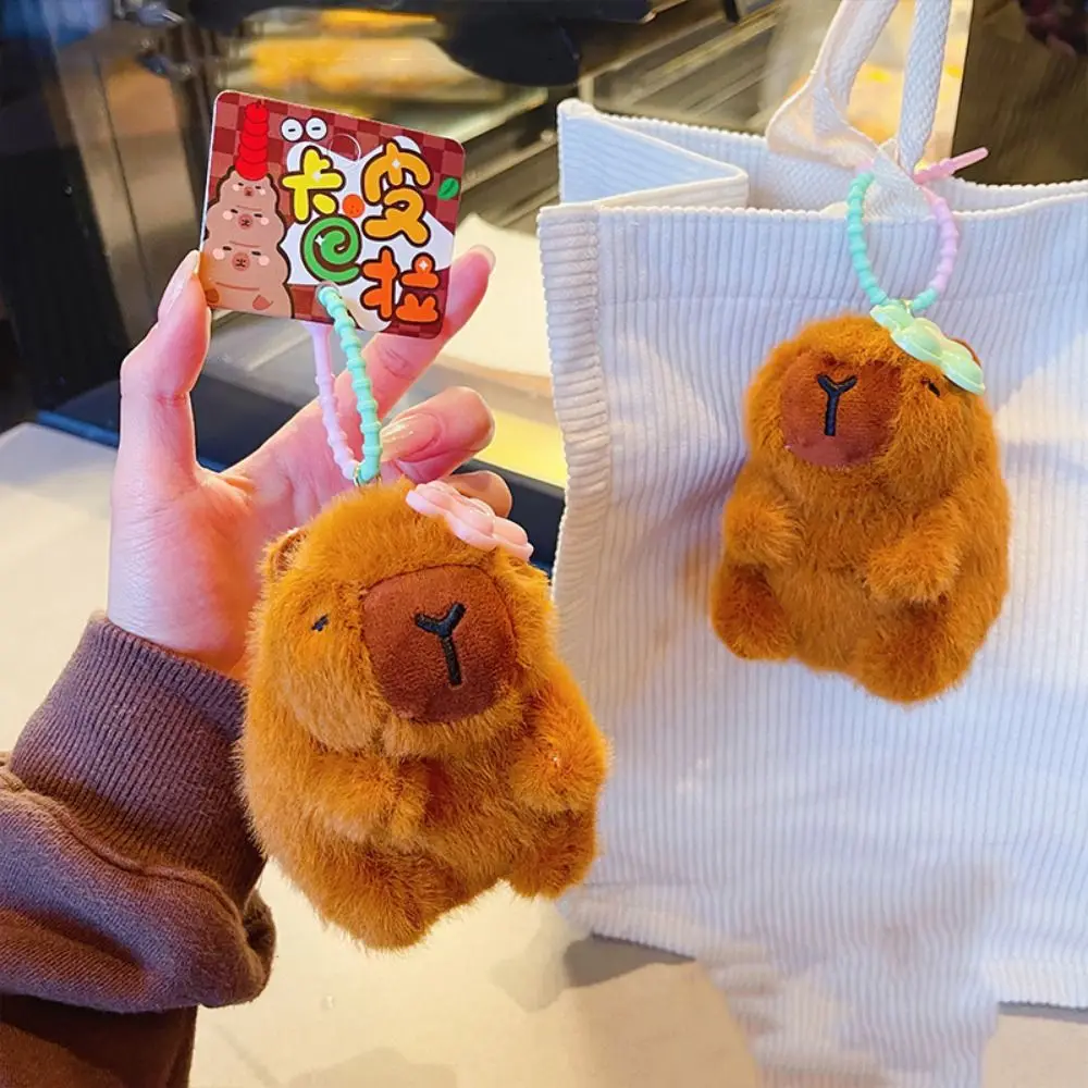 カピバラぬいぐるみペンダントキーホルダー、小さな花、かわいいぬいぐるみキーホルダー、面白いカピバラぬいぐるみ、10cm