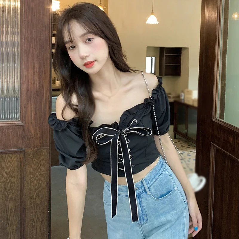 Frauen Bluse sexy süße Puff Ärmel schnüren ausgesetzt Nabel koreanischen Slash Neck Frühling Sommer vielseitige Top vielseitige Top