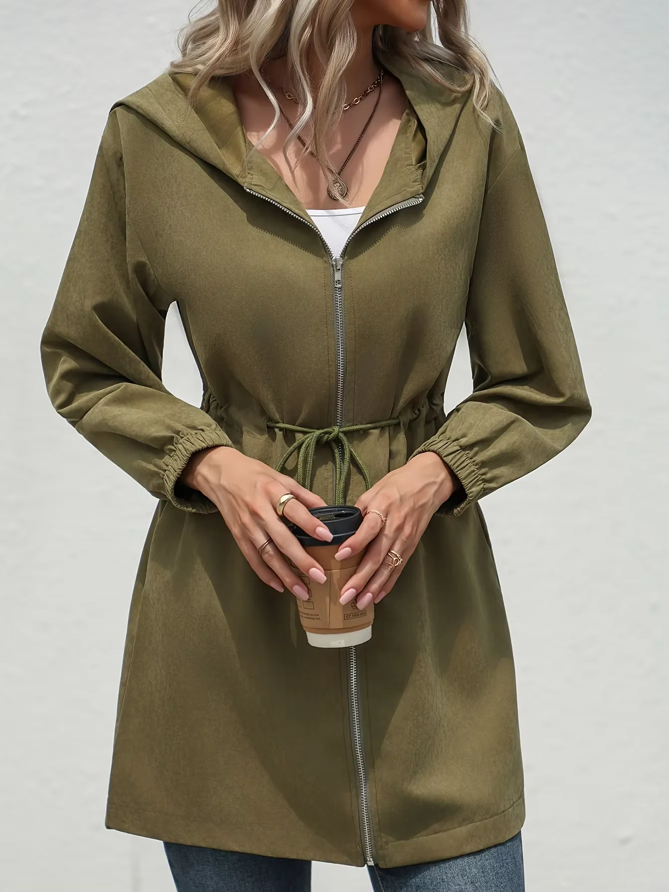 A new autumn and winter fashion mid-length jacket with a cinched waist and a hood for young girls in Europe and America