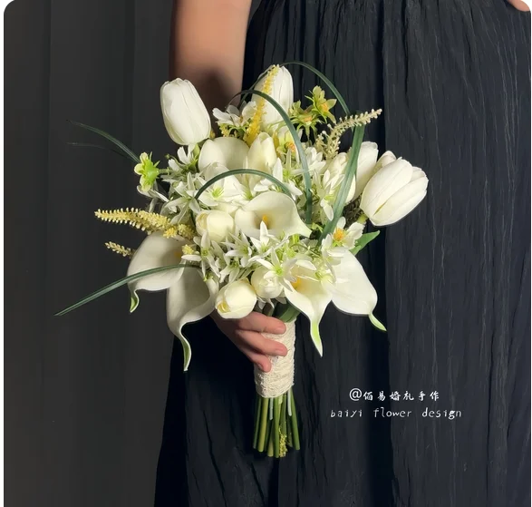 White bride holding a bouquet of artificial flowers tulip calla lily Joker hot wedding real shot engagement flowers.