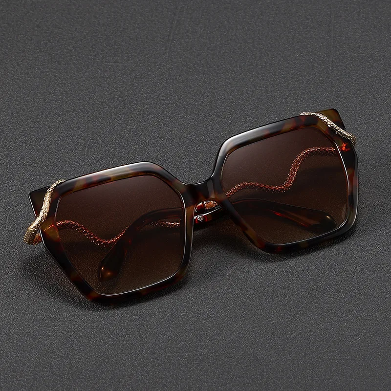 New Year of the Snake edition:metal snake‑shaped temple sunglasses with a bold square frame, color‑block design, and patented st
