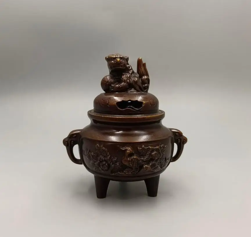 

The peacock opens the screen and the lion covers the copper incense burner