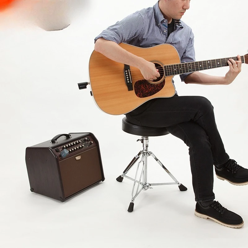 Speakers, electric box piano, folk guitar playing and singing stereo