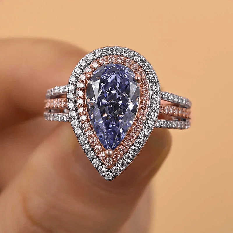 Elegant Pear-shaped Blue Color Cubic Zirconia Ring Featuring A Double-band Design The Perfect Choice A Women’s Engagement Ring.