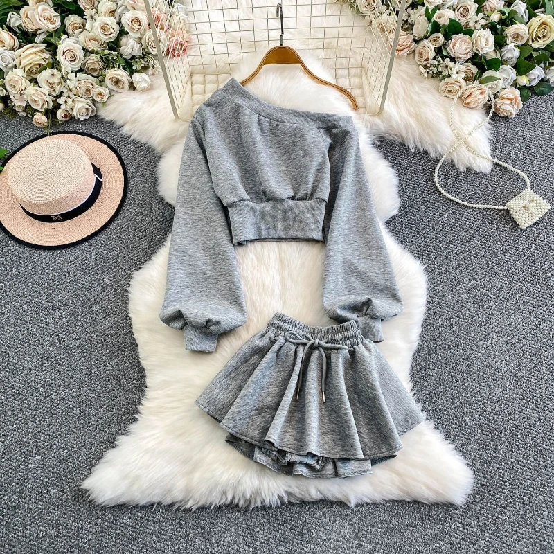 

Lazy style casual two piece set niche personality irregular slanted collar off shoulder long sleeved top+pleated short skirt