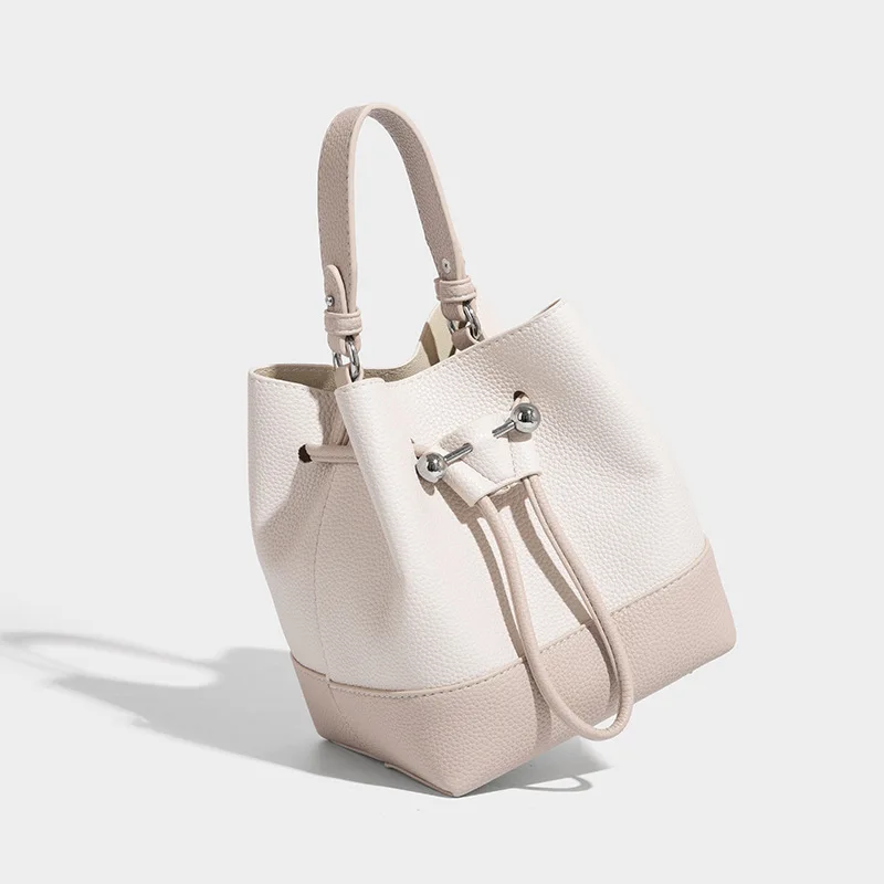 المتخصصة تصميم ريترو الرباط دلو حقيبة المرأة 2025 صيف جديد الراقية المحمولة الكتف رسول حقيبة نسائية