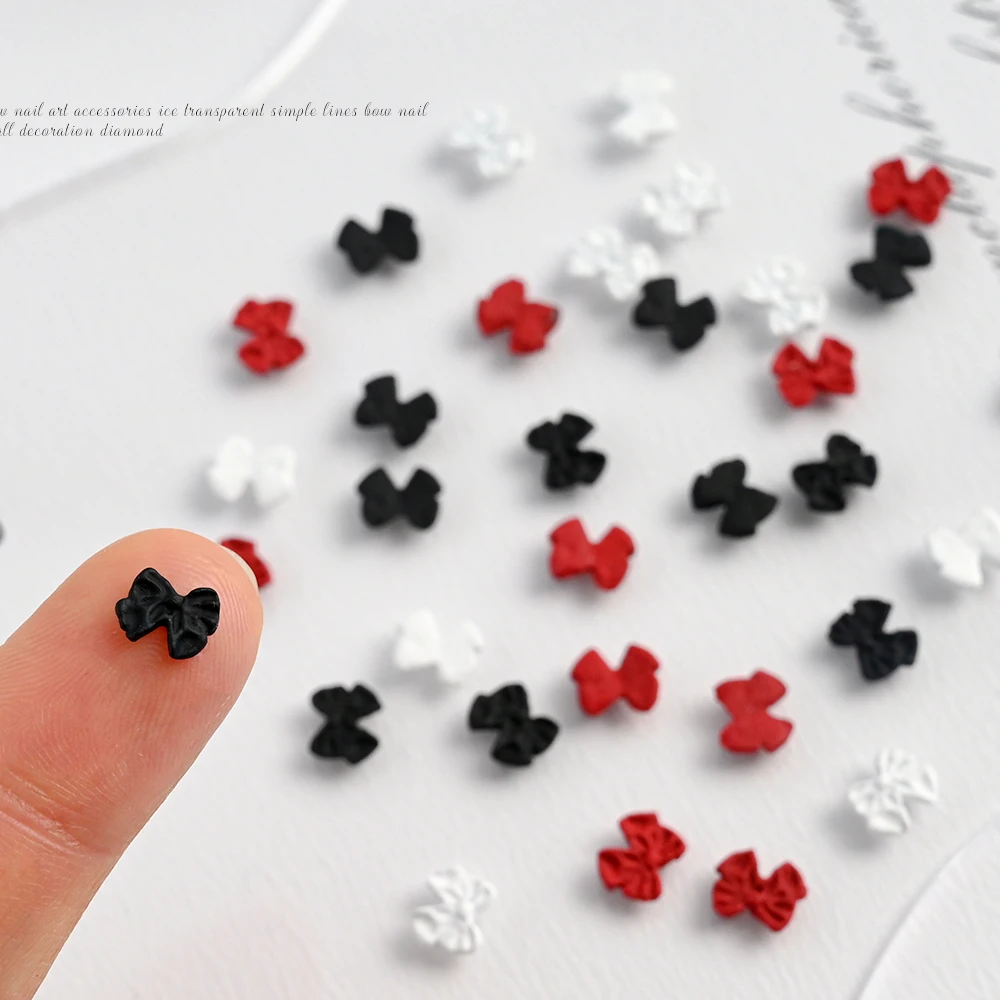 50 pçs 3d vermelho kawaii arco prego encantos branco preto resina doce bowknot flatback decoração da arte do prego 7*6mm bonito acessórios de manicure