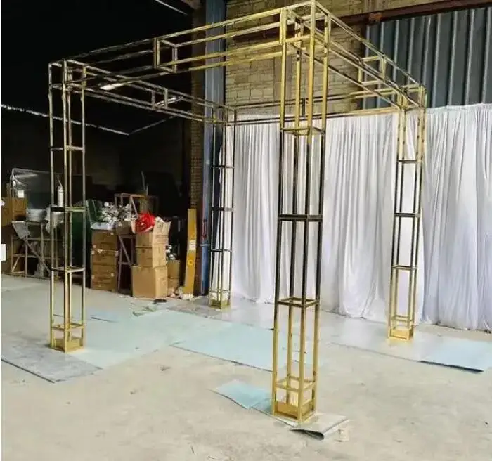 Vertical decorative frame of arch ceremony Pavilion in shining gold wedding square