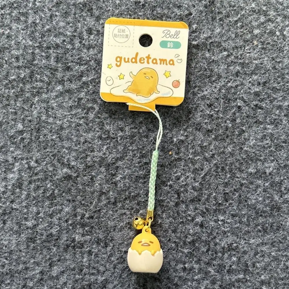 Nuevo llavero Kawaii Sanrio Gudetama Bell, juguete para niños y niñas, cartera, bolso con cremallera, funda para auriculares, decoración de dibujos animados, regalos de vacaciones