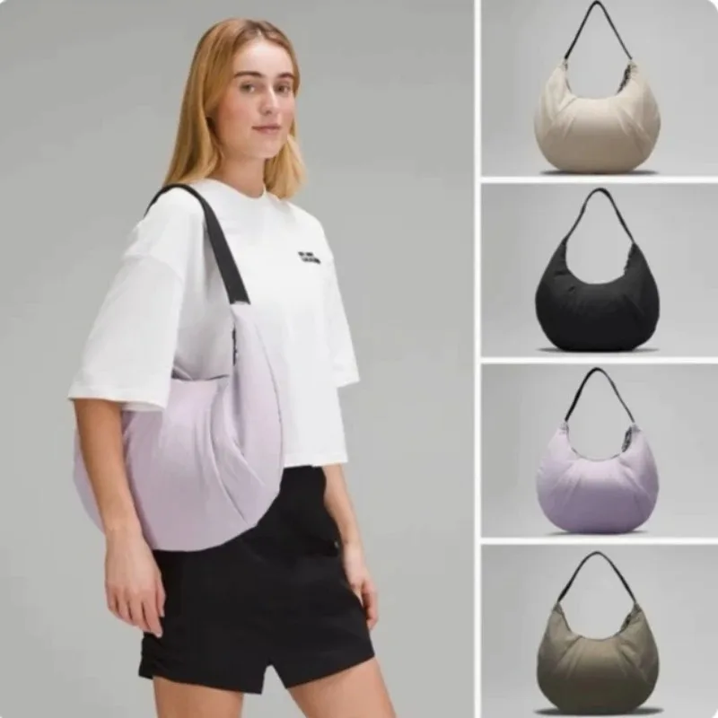 

Metal logo simple fashion large capacity yoga leisure sports girls commuter shoulder bag croissant