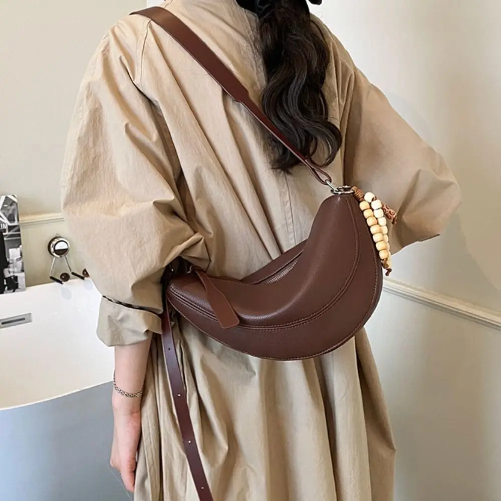 

Elegant Vintage PU Dumpling Bag Solid Color Retro Small Saddle Bag Casual with Pendant Half Moon Bag Streetwear
