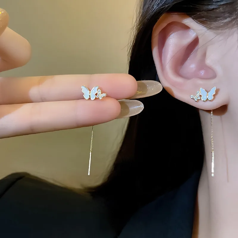 Boucles d'oreilles pendantes à long pompon papillon pour femmes, ligne d'oreille, bijoux goutte de perle, tempérament doux coréen, indépendant, nouveau, 2023