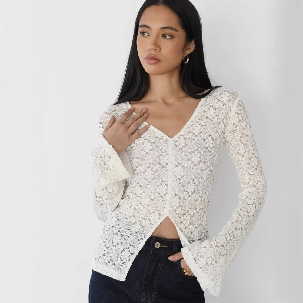 MsChuh Women's Long-sleeve Fitted Top Featuring A Lace Cutout Design Pearl Button Side Slits And Flared Sleeves Temperament Slim