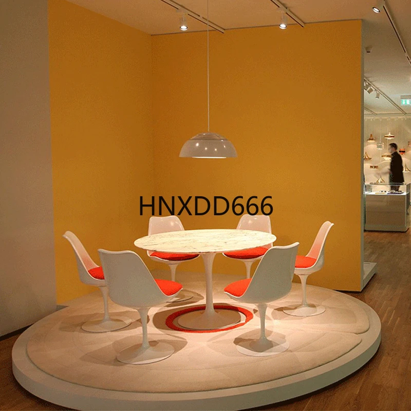 Rotating armchair dining table and chair combination