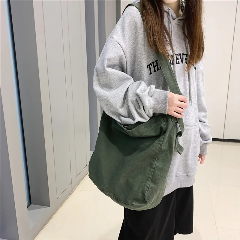 

Vintage canvas bag ins Han Feng solid color college students class Japanese winter bag female 2021 new crossbody bag